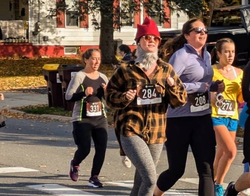 people in costumes including gnomes running 5k