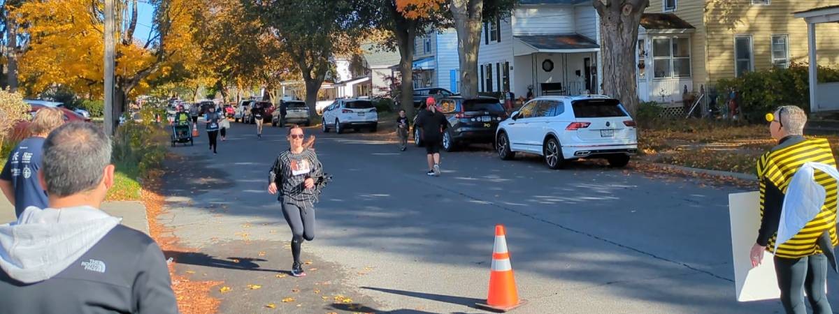 woman in spider costume running