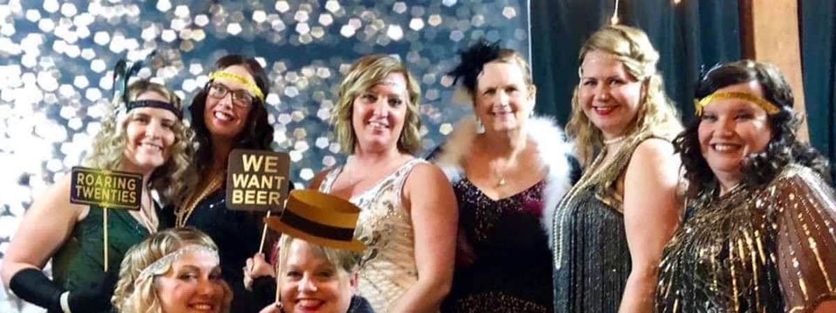 mom prom attendees dressed in a roaring 20s theme