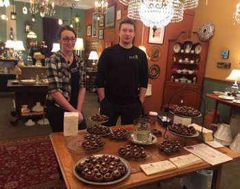 man and woman near chocolate samples