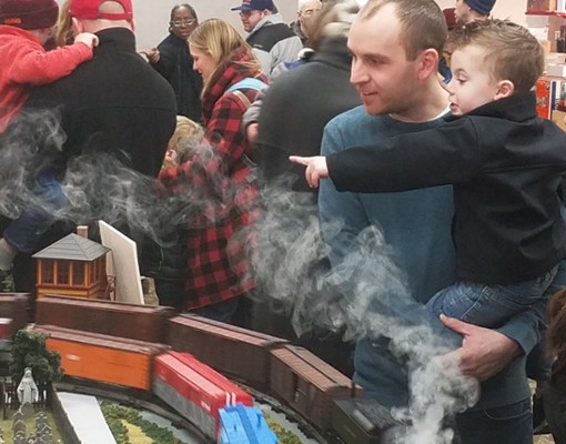 Family in front of Train Set