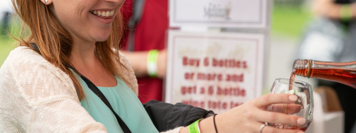 woman getting a sample of wine