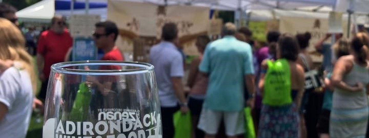 empty wine glass in front of a tent
