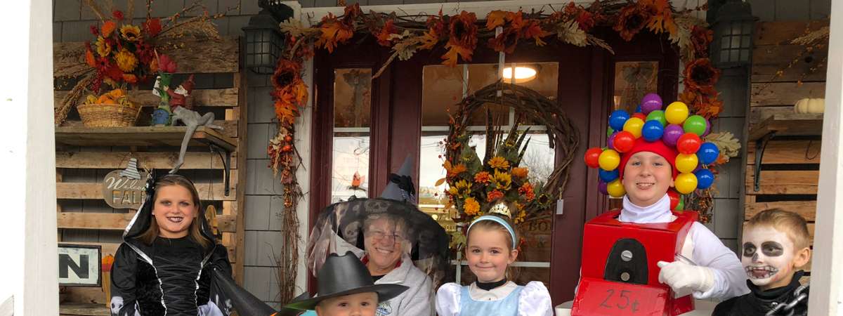 five kids dressed in halloween costumes