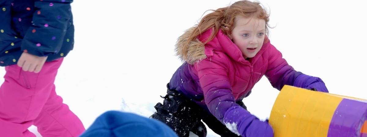 little girl with sled