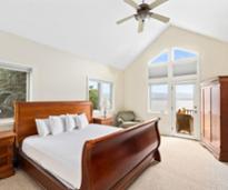 house rental bedroom with high ceiling and ceiling fan