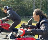 two people on atvs