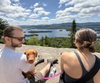 hikers with dog at summit