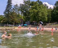 kids playing in water at usher park beach in lake george