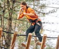 young girl on treetop course