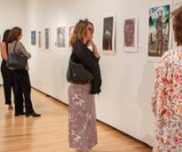 women at the hyde looking at paintings