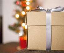 a brown gift box with a silver ribbon