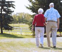 senior citizens holding hands