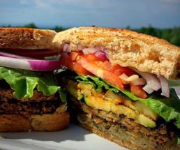 closeup of what looks like an eggplant sandwich outdoors