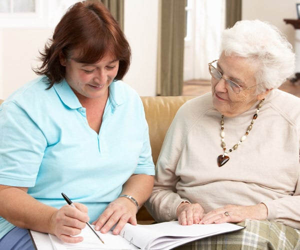 senior services worker and older woman