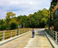 woman hikes near canal