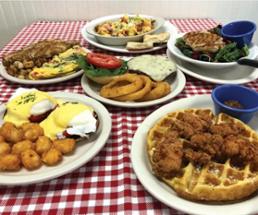 breakfast and lunch plate dishes, including waffles and chicken