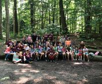 summer camp group outside in woods