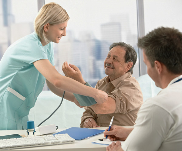 nurse taking man's blood pressure