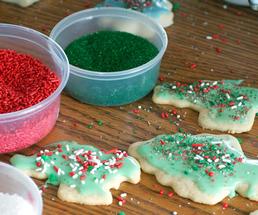 christmas cookies being decorated