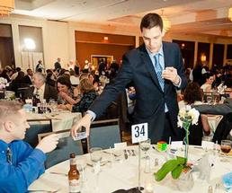steven brundage performing magic at an event