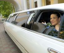 bride in limo arriving at wedding reception