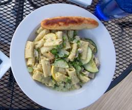 pasta with bread on patio table