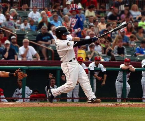 a baseball player swinging the bat