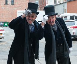 two men tipping hats in victorian garb