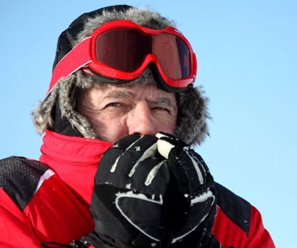 a man dressed in winter clothes who is cold