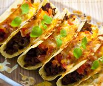 hard shell tacos with cheese on top