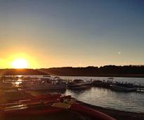 boats on saratoga lake at sunset