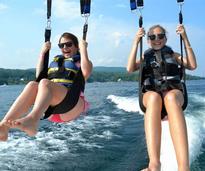girls parasailing over lake george