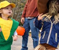 kids in costumes - ear of corn and scarecrow