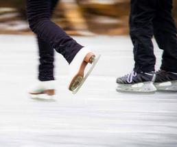 close up of two ice skaters