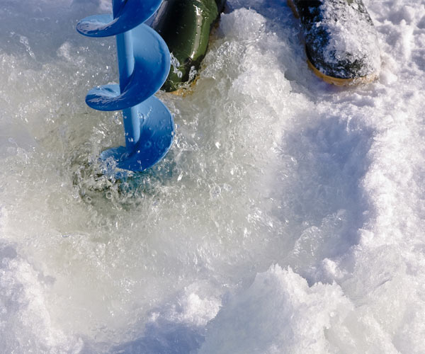 testing ice thickness with an auger