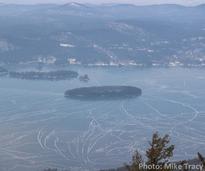 view of frozen lake from mountain