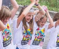 summer camp kids getting splashed