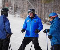 skiers dressed in blue