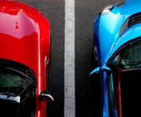red and blue cars in parking lot