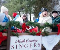 north country singers singing in holiday parade