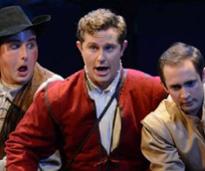 three actors on stage