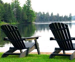adirondack chairs on a lake