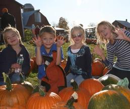 kids near pumpkins