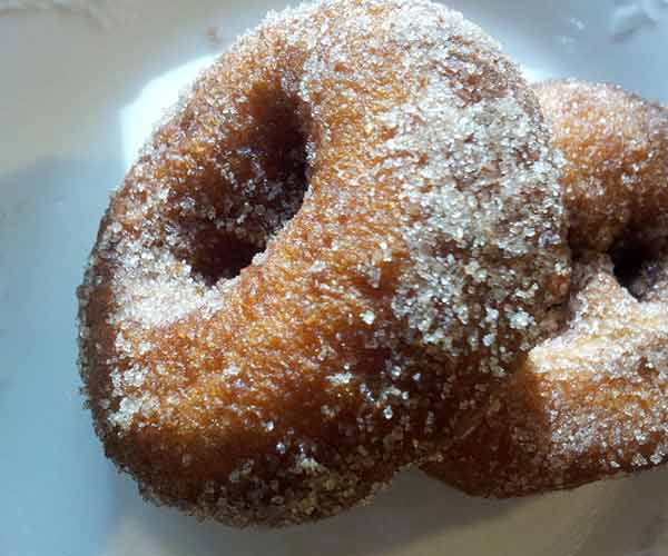 Apple cider donuts covered in granulated sugar