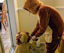 mom and toddler lions trick-or-treating