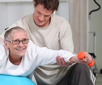 physical therapist working with client