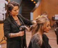 woman getting a blowout at a hair salon