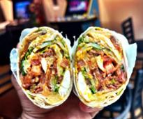chicken wrap being held up