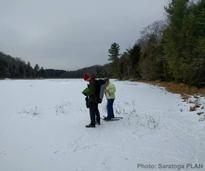 people snowshoeing in the palmertown conservation area